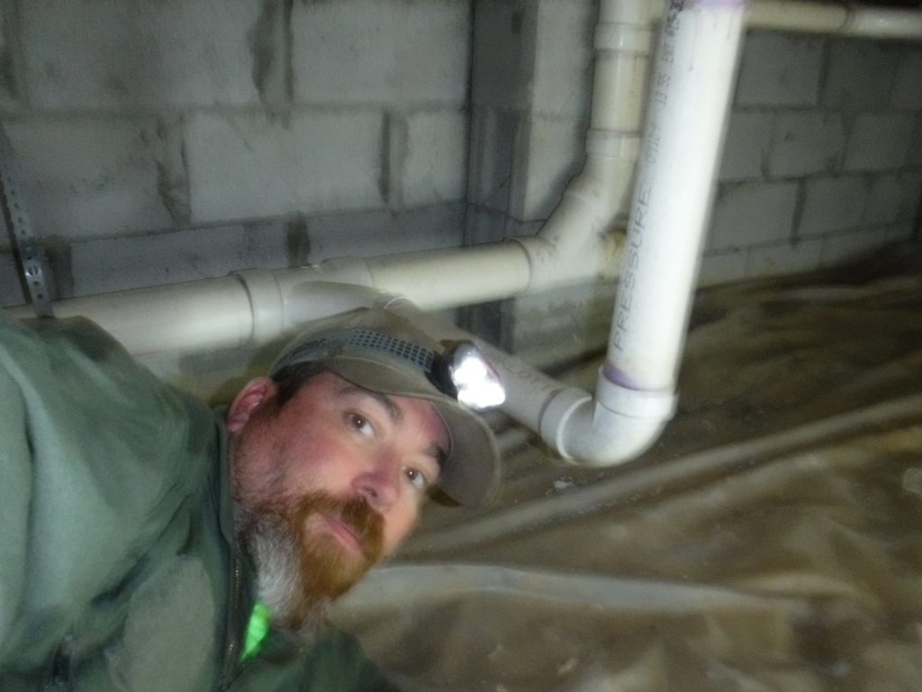 bryan inspecting the crawl space during a home inspection in new bern nc